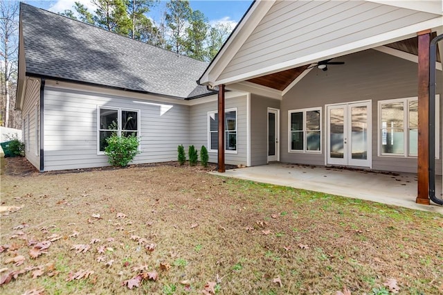 back of property featuring a yard, a patio, and ceiling fan