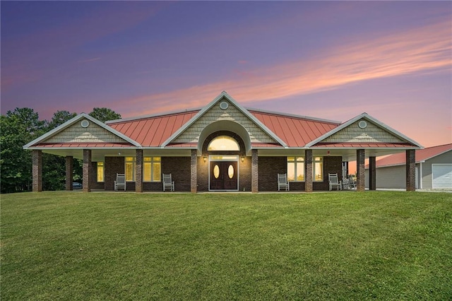 231 Gordon Rd, Cedartown, GA 30125 - craftsman inspired home with a standing seam roof, a front lawn, a porch, a metal roof, and brick siding
