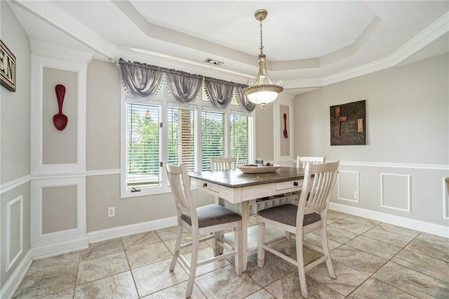 231 Gordon Rd, Cedartown, GA 30125 - dining space featuring a tray ceiling, a decorative wall, and wainscoting