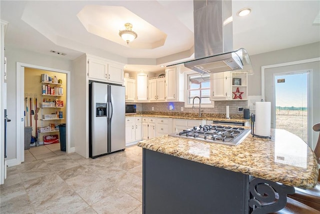 231 Gordon Rd, Cedartown, GA 30125 - kitchen featuring stainless steel appliances, island exhaust hood, tasteful backsplash, and light stone countertops