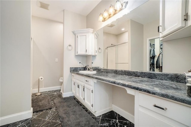231 Gordon Rd, Cedartown, GA 30125 - full bathroom featuring marble tiled floors, a stall shower, vanity, and a walk in closet