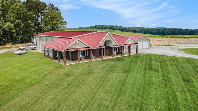 231 Gordon Rd, Cedartown, GA 30125 - view of front of property with a front yard, a detached garage, and a metal roof