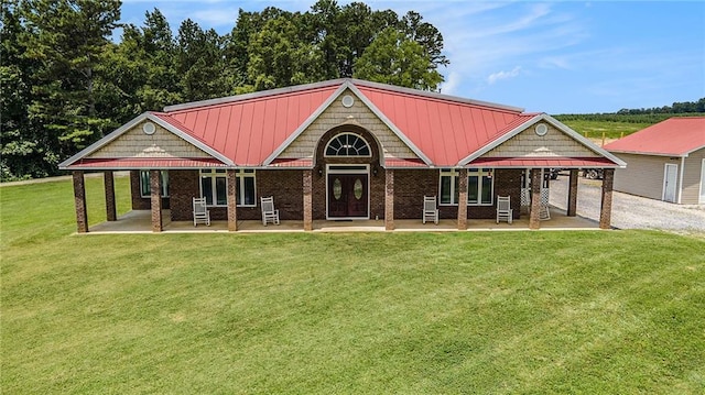 231 Gordon Rd, Cedartown, GA 30125 - craftsman house featuring a front yard, brick siding, and a metal roof