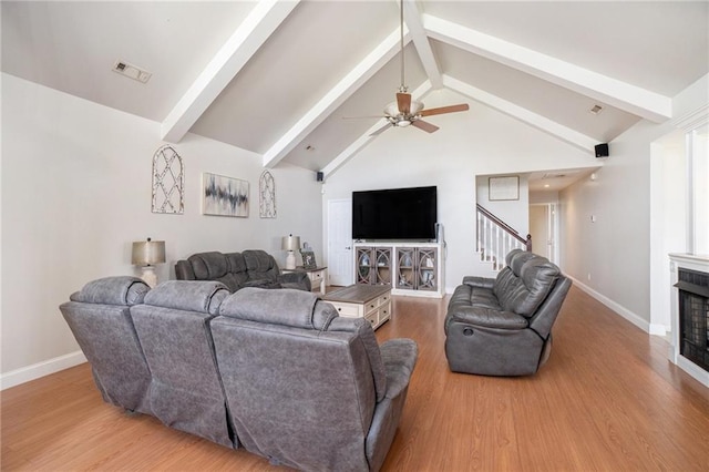 231 Gordon Rd, Cedartown, GA 30125 - living area with a ceiling fan, beamed ceiling, wood finished floors, stairs, and high vaulted ceiling