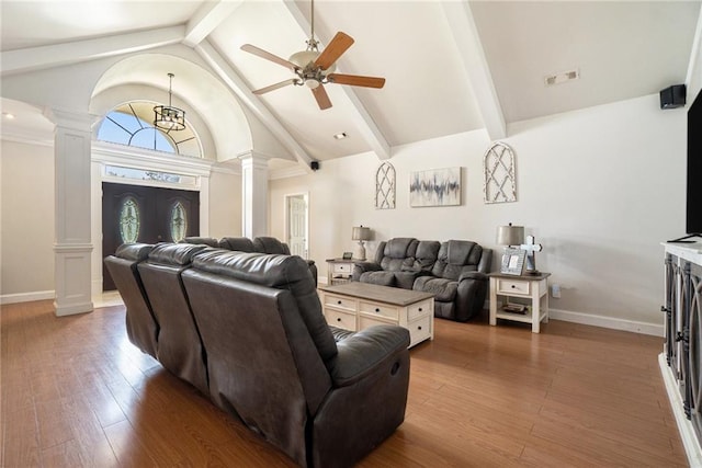 231 Gordon Rd, Cedartown, GA 30125 - living room with ornate columns, a ceiling fan, beam ceiling, wood finished floors, and high vaulted ceiling