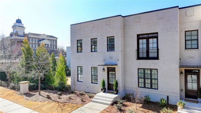 view of front of house with brick siding