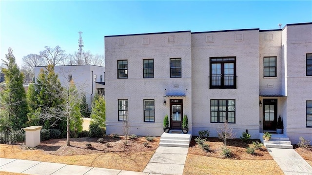 view of front of property featuring brick siding