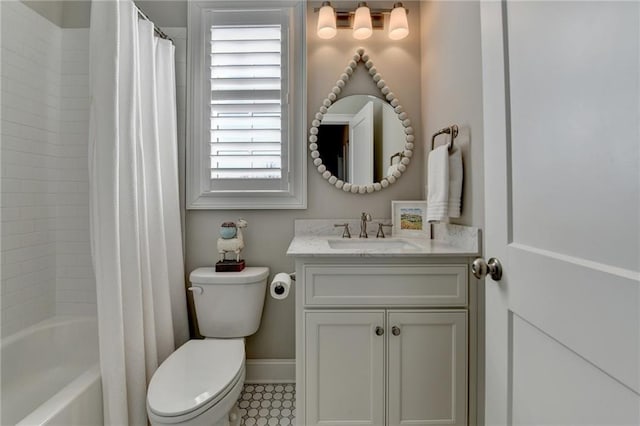 bathroom with shower / bath combo, vanity, toilet, and baseboards