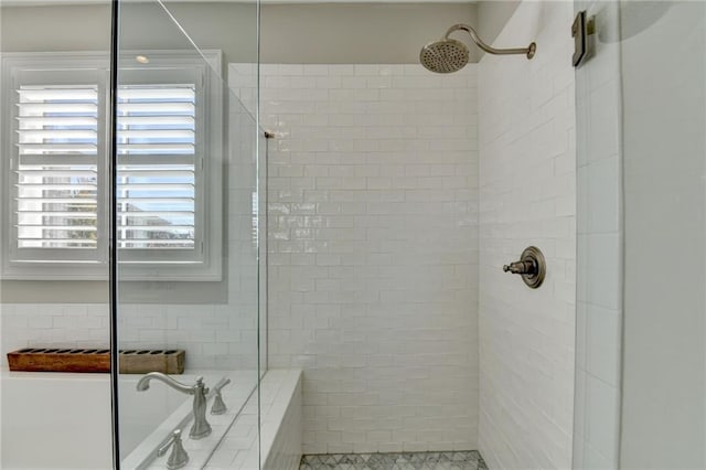 full bathroom with a tile shower