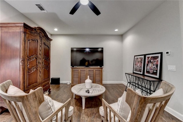 living area with ceiling fan, recessed lighting, wood finished floors, visible vents, and baseboards