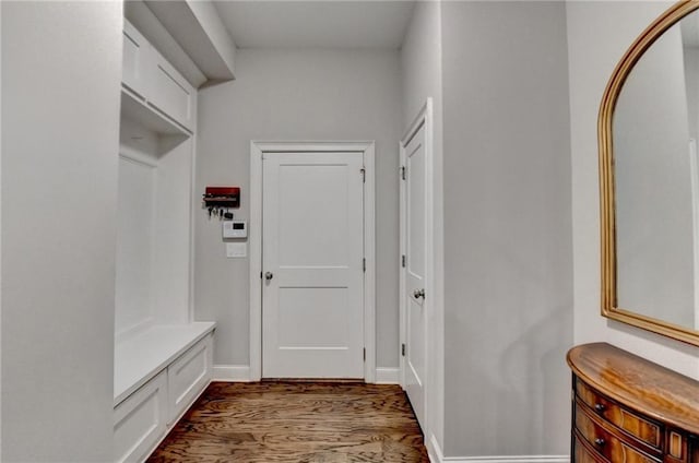 mudroom with baseboards and wood finished floors