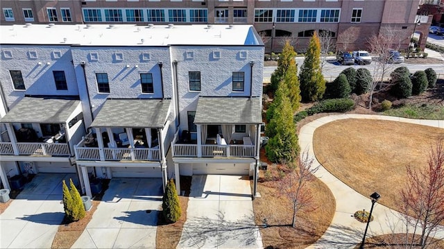 back of house featuring driveway