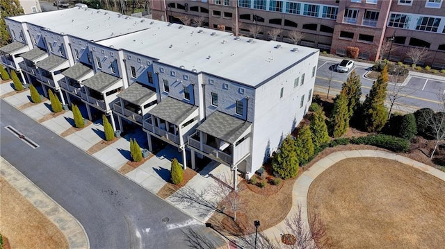 birds eye view of property with a residential view