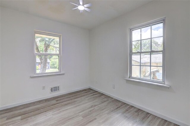 6454 Boca Grande Blvd, Forest Park, GA 30297 - spare room featuring light wood-style flooring, baseboards, and ceiling fan