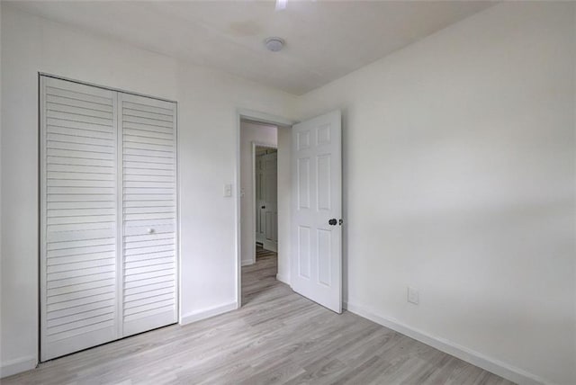 6454 Boca Grande Blvd, Forest Park, GA 30297 - unfurnished bedroom featuring light wood-type flooring, baseboards, and a closet