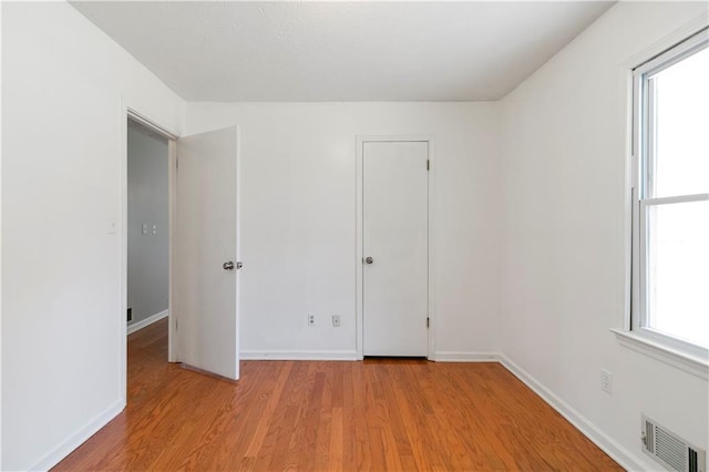 37 Indian Hills Ct, Dallas, GA 30157 - empty room featuring light wood finished floors, visible vents, and baseboards