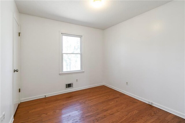 37 Indian Hills Ct, Dallas, GA 30157 - empty room featuring visible vents, baseboards, and wood finished floors