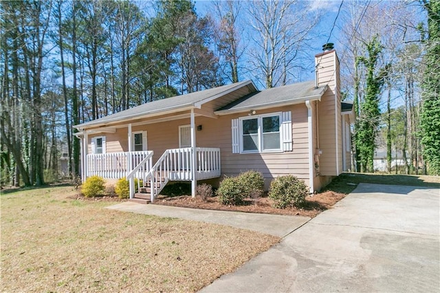 37 Indian Hills Ct, Dallas, GA 30157 - single story home featuring driveway, covered porch, a chimney, and a front lawn
