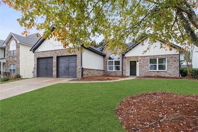 ranch-style home with brick siding, a front yard, driveway, and a garage