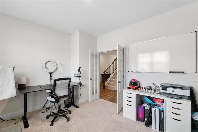 office space featuring french doors, baseboards, and carpet floors