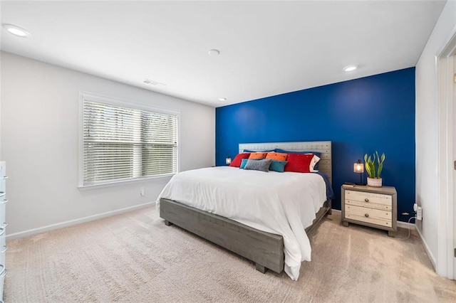 carpeted bedroom featuring visible vents, recessed lighting, and baseboards