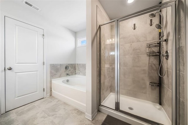 full bathroom with visible vents, a stall shower, and a garden tub