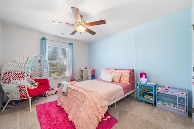 carpeted bedroom featuring visible vents and ceiling fan