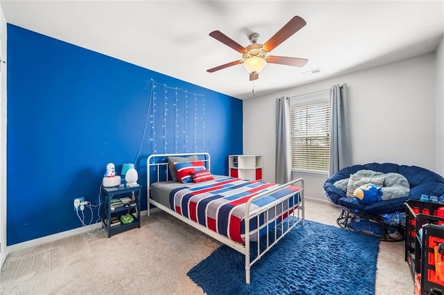 bedroom with visible vents, a ceiling fan, baseboards, and carpet floors