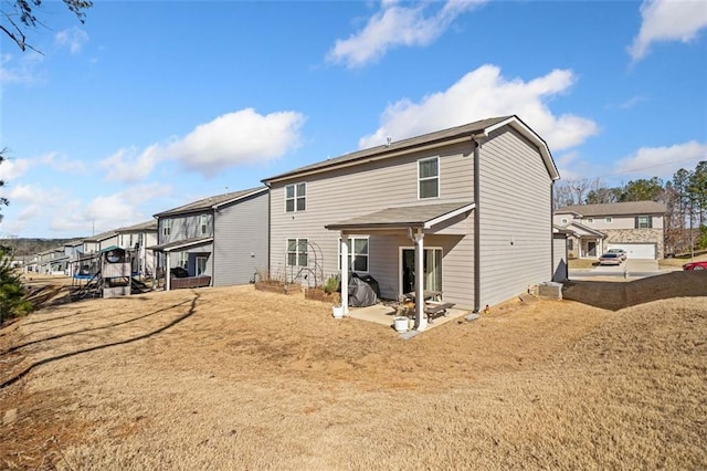 back of house with a patio and a residential view