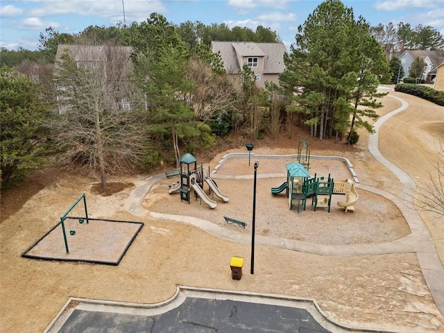 view of home's community featuring playground community