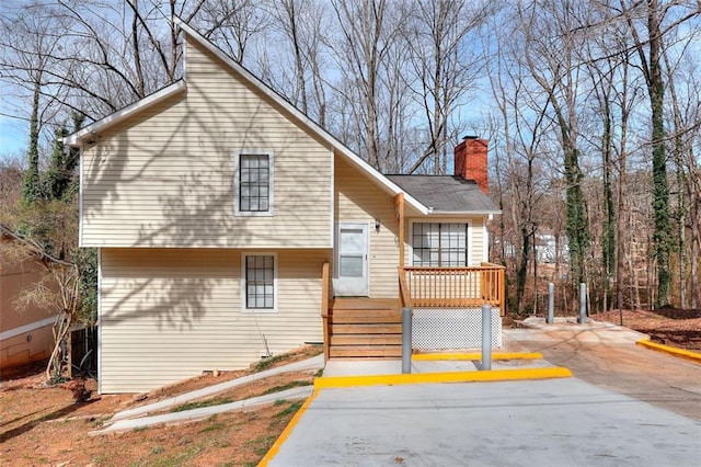 view of front of home featuring a chimney