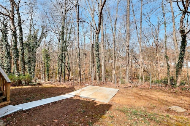 view of yard with a forest view