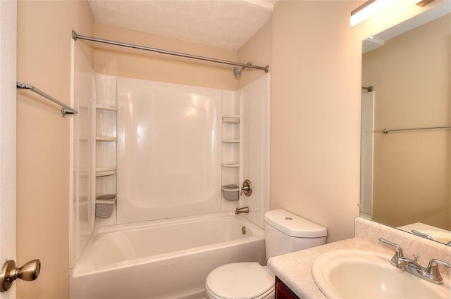 full bathroom with toilet, shower / tub combination, a textured ceiling, and vanity