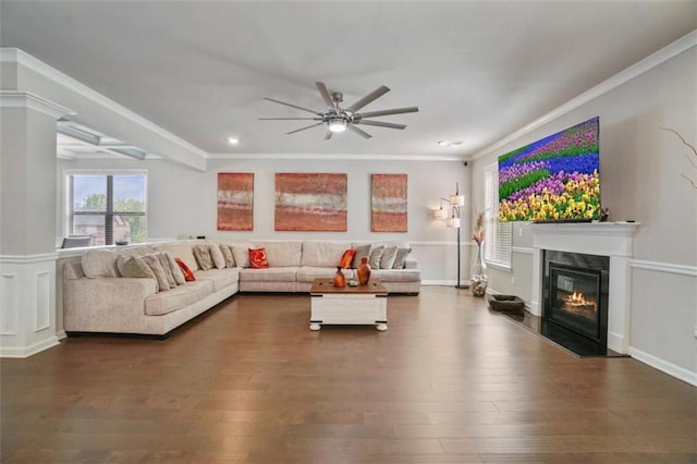 living area with crown molding, ceiling fan, recessed lighting, wood finished floors, and a high end fireplace