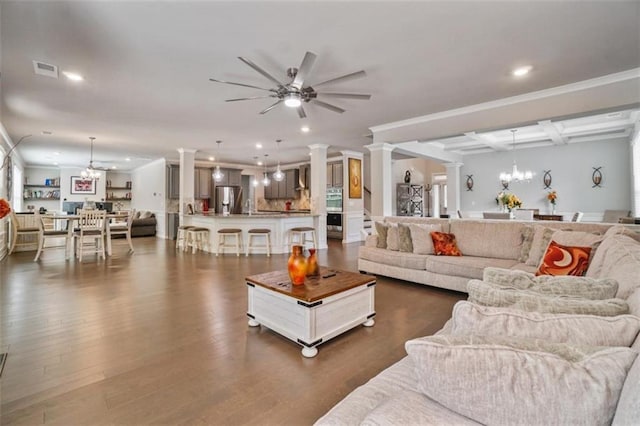 living area with ornamental molding, beam ceiling, ornate columns, recessed lighting, and ceiling fan with notable chandelier