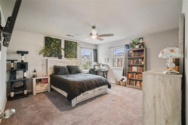 bedroom with a ceiling fan, baseboards, visible vents, and carpet