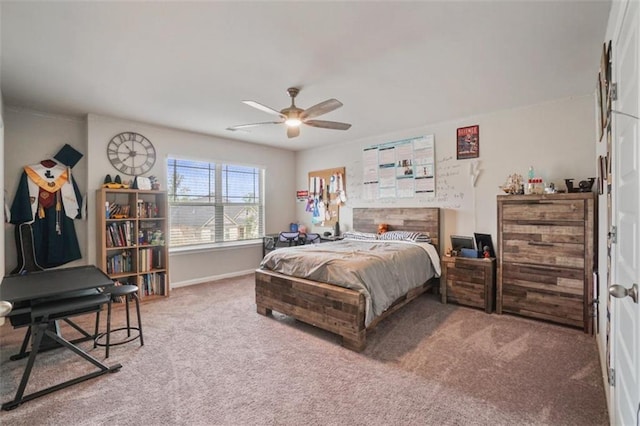 bedroom featuring baseboards, carpet flooring, and ceiling fan