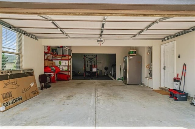 garage with freestanding refrigerator
