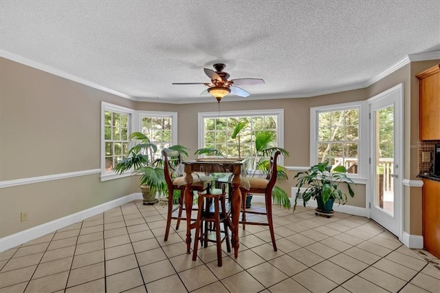 5891 Ranger Ct, Peachtree Corners, GA 30092 - dining room with a ceiling fan, crown molding, light tile patterned floors, baseboards, and a textured ceiling