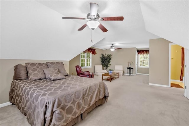 5891 Ranger Ct, Peachtree Corners, GA 30092 - bedroom with light carpet, multiple windows, baseboards, and vaulted ceiling