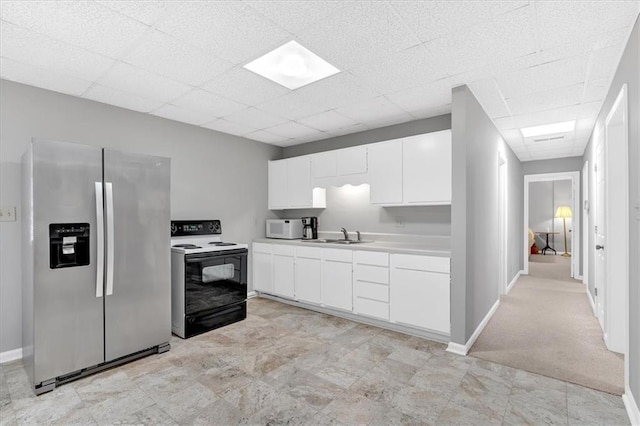 5891 Ranger Ct, Peachtree Corners, GA 30092 - kitchen featuring stainless steel fridge with ice dispenser, electric range, white microwave, a drop ceiling, and light countertops