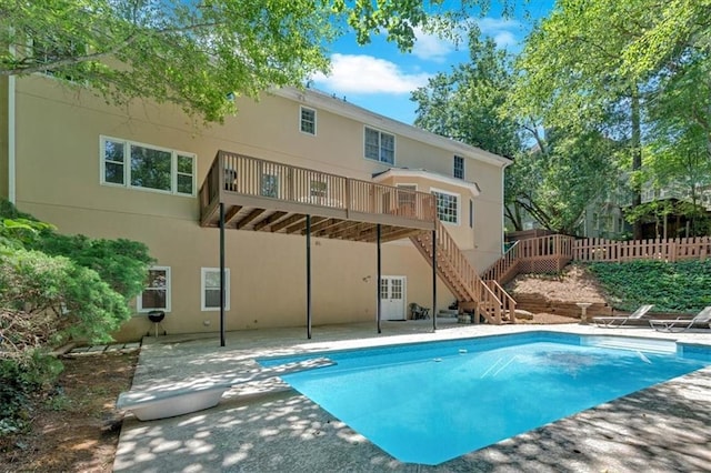 5891 Ranger Ct, Peachtree Corners, GA 30092 - rear view of house featuring a patio, a wooden deck, stucco siding, and stairway