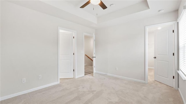 1570 Halbrook Pl, Marietta, GA 30008 - unfurnished bedroom featuring baseboards, a raised ceiling, and carpet
