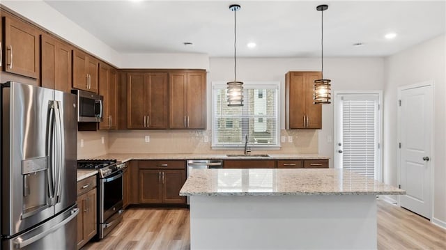 1570 Halbrook Pl, Marietta, GA 30008 - kitchen with light wood finished floors, appliances with stainless steel finishes, tasteful backsplash, and a sink