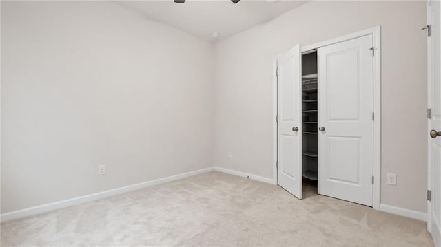 1570 Halbrook Pl, Marietta, GA 30008 - unfurnished bedroom featuring light colored carpet, baseboards, and ceiling fan