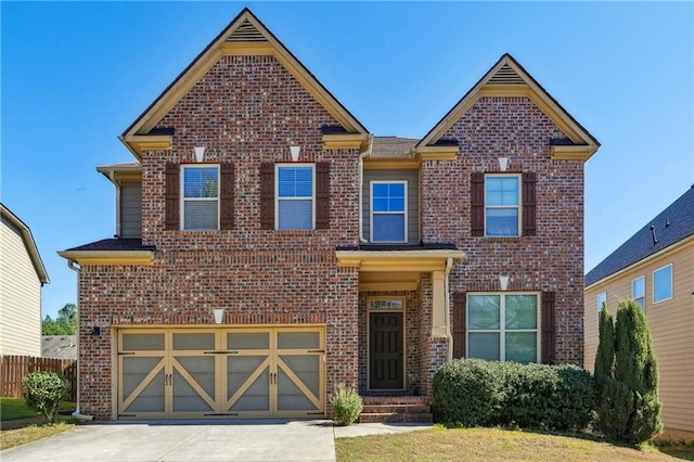 view of front of home with concrete driveway, brick siding, an attached garage, and fence