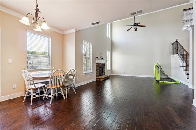 dining area with a wealth of natural light, visible vents, and wood finished floors