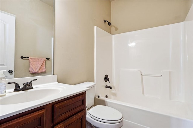 full bathroom with washtub / shower combination, vanity, and toilet