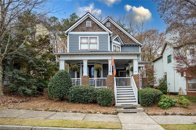 craftsman-style home featuring covered porch