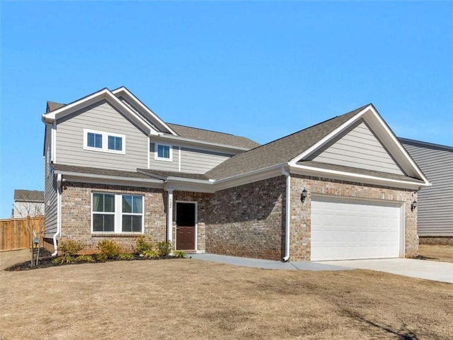 view of front facade featuring driveway, an attached garage, fence, a front lawn, and brick siding